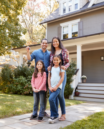 Family living in Nevada in front of home