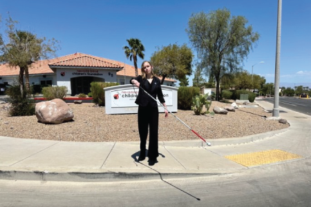 Kaylynn Diebold at a crosswalk paralell to traffic