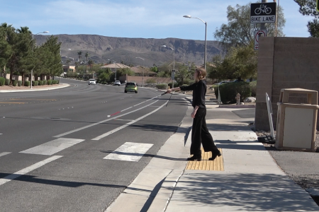 Kaylynn Diebold at a crosswalk perpendicular to traffic